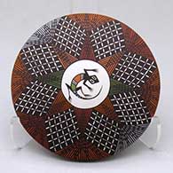 A polychrome seed pot decorated with a lizard in a medallion surrounded by a fineline and geometric design
 by Sharon Lewis of Acoma