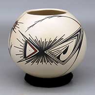 A polychrome jar decorated with a two panel stylized bird and geometric design
 by Martha Quezada of Mata Ortiz and Casas Grandes