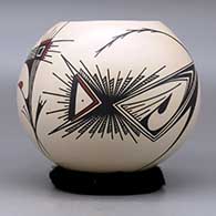 A polychrome jar decorated with a two panel stylized bird and geometric design, click or tap to see a larger version