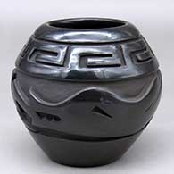 A black jar carved around the body with an avanyu  and scrolls design
 by Jennifer Naranjo of Santa Clara