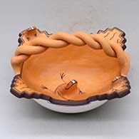 A polychrome bowl with a twisted handle and three frog appliques plus a tadpole and geometric design
 by Agnes Peynetsa of Zuni