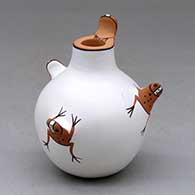 A small polychrome jar decorated with four frog appliques for handles
 by Agnes Peynetsa of Zuni