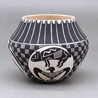 A black on white jar decorated with a medallion, Mimbres wildlife, checkerboard, feather and geometric design
 by Emmalita Chino of Acoma