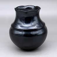 A plain polished black double shouldered water jar with a pie crust rim
 by Tina Garcia of Santa Clara