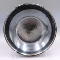 Large plain polished black bowl
 by Maria Martinez of San Ildefonso