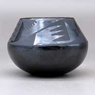 A black on black jar decorated with a four panel bat wing and geometric design above the shoulder, click or tap to see a larger version