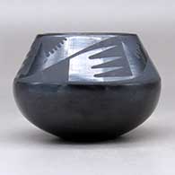 A black on black jar decorated with a four panel bat wing and geometric design above the shoulder, click or tap to see a larger version