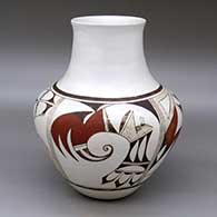 A polychrome vase with a recurved neck and decorated around the body with a four panel bird element and geometric design
 by Joy Navasie aka 2nd Frogwoman of Hopi