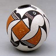 Click for a larger view A miniature polychrome seed pot decorated with a two panel bird element and geometric design
by Lucy Lewis of Acoma