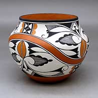 A polychrome jar decorated with a four panel rainbow and geometric design
 by Robert Patricio of Acoma