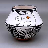 A polychrome jar decorated with a three panel bear with heart line design above the shoulder and a four panel geometric design below the shoulder
 by Wilfred Garcia of Acoma