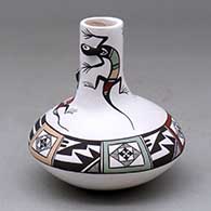 A small polychrome jar with a tall neck and decorated with lizard head appliques and a lizard and geometric design
 by Carolyn Concho of Acoma