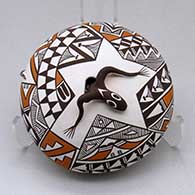 A polychrome seed pot decorated with a lizard applique and painted with a lizard, fineline and geometric design
 by Sharon Lewis of Acoma