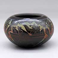 A polychrome bowl decorated with a sgraffito dancer and geometric design
 by Ergil Vallo of Acoma