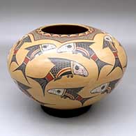 A polychrome jar decorated with prehistoric fish and geometric design
 by Roberto Banuelos of Mata Ortiz and Casas Grandes