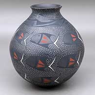A polychrome jar with a recurved rim and decorated with a fish and geometric design
 by Efrain Lucero of Mata Ortiz and Casas Grandes