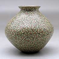 A small polychrome jar with a flared lip and decorated with a tiny lines and rectangles geometric design, click or tap to see a larger version