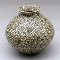 A small polychrome jar with a flared lip and decorated with a tiny lines and rectangles geometric design
 by Elvira Bugarini of Mata Ortiz and Casas Grandes
