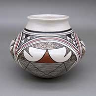 Polychrome jar with a slightly flared opening and a geometric design
 by Sylvia Naha of Hopi