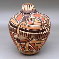 Click for a larger view A polychrome jar decorated with a carved, sgraffito and painted kachina, pueblo dancer, feather and geometric design
 by Thomas Polacca of Hopi