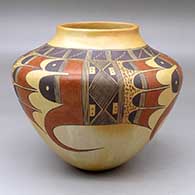 A polychrome high-shoulder jar decorated with a four panel bird hanging from sky band and geometric design around the shoulder
 by Jean Sahmie of Hopi