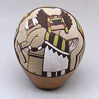 A pair of kachina dancers surrounded by a geometric design
 by Lawrence Namoki of Hopi