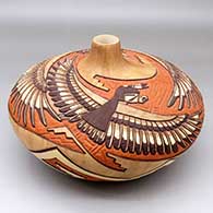 A large polychrome seed pot carved and painted with an Eagle Dancer and Eagle Boy and geometric design, click or tap to see a larger version