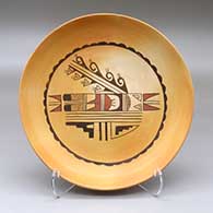 A shallow polychrome bowl decorated inside with a bird element and geometric design
 by Sheryl Honanie of Hopi