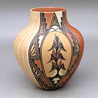 A polychrome jar with two panels of carved melon design and two panels of painted corn plant and geometric design
 by Virginia Ponca Fragua of Jemez