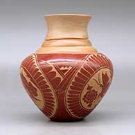 A red on tan triple shouldered jar with a flared rim decorated with a three panel sgraffito butterfly, flower, feather and geometric design, click or tap to see a larger version