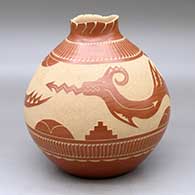 A red jar with a notched, organic rim and decorated around the body with a sgraffito avanyu, feather, cloud, kiva step and geometric design
 by Aaron Cajero Jr of Jemez