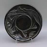 Black plate with carved avanyu design
 by Severa Tafoya of Santa Clara