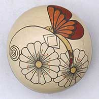 A polychrome seed pot decorated with a butterfly, flower and geometric design
 by Lois Gutierrez of Santa Clara