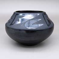 Black-on-black jar with a four-panel geometric design
 by Maria Martinez of San Ildefonso