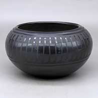 Click for a larger view A black on black bowl decorated with a band of feathers design around the shoulder
by Blue Corn of San Ildefonso