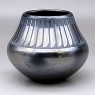 A black on gunmetal black jar decorated with a ring of feathers design above the shoulder
 by Maria Martinez of San Ildefonso