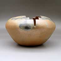 A large golden micaceous prayer jar with fire clouds and a geometric carved opening, click or tap to see a larger version