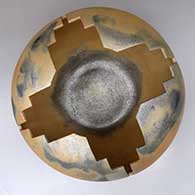 A large golden micaceous prayer jar with fire clouds and a geometric carved opening, click or tap to see a larger version