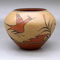 A polychrome jar decorated with a four-panel roadrunner, flower, cloud and geometric design
 by Eleanor Pino Griego of Zia