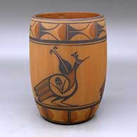 A polychrome cylinder decorated with a three-panel roadrunner, rain bird and geometric design
 by Eleanor Pino Griego of Zia