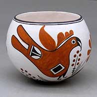 A polychrome bowl decorated with a parrot, flower, plant and geometric design
 by Emma Lewis of Acoma