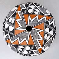 A polychrome seed pot decorated with a parrot, fineline and geometric design
 by Grace Chino of Acoma