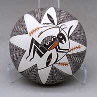 A polychrome seed pot decorated on top with a grasshopper, plant, fineline and geometric design
 by Rebecca Lucario of Acoma