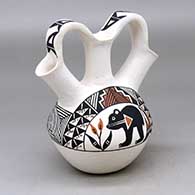 A triple spout polychrome wedding vase decorated with a bear with heart line, rainbow, flower and geometric design
 by Yolanda Trujillo of Acoma