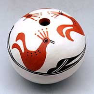 A polychrome seed pot decorated with a three panel turkey, cloud and geometric design above the shoulder
 by Dolores Lewis of Acoma