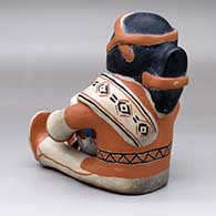 A sitting male drummer figure with a drum and drum stick, click or tap to see a larger version