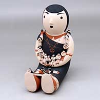 A sitting grandmother storyteller figure with 19 tiny children
 by Dena Suina of Cochiti