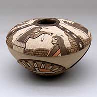 A polychrome seed pot decorated with a lightly carved, sgraffito and painted kachina, stone wall, bird element and geometric design
 by Lawrence Namoki of Hopi