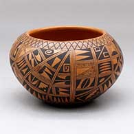 A black on red bowl polished inside and decorated on the outside with a small sherd and geometric design
 by Rondina Huma of Hopi