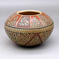 A polychrome bowl, polished inside and decorated on the outside with a small sherd and geometric design
 by Rondina Huma of Hopi